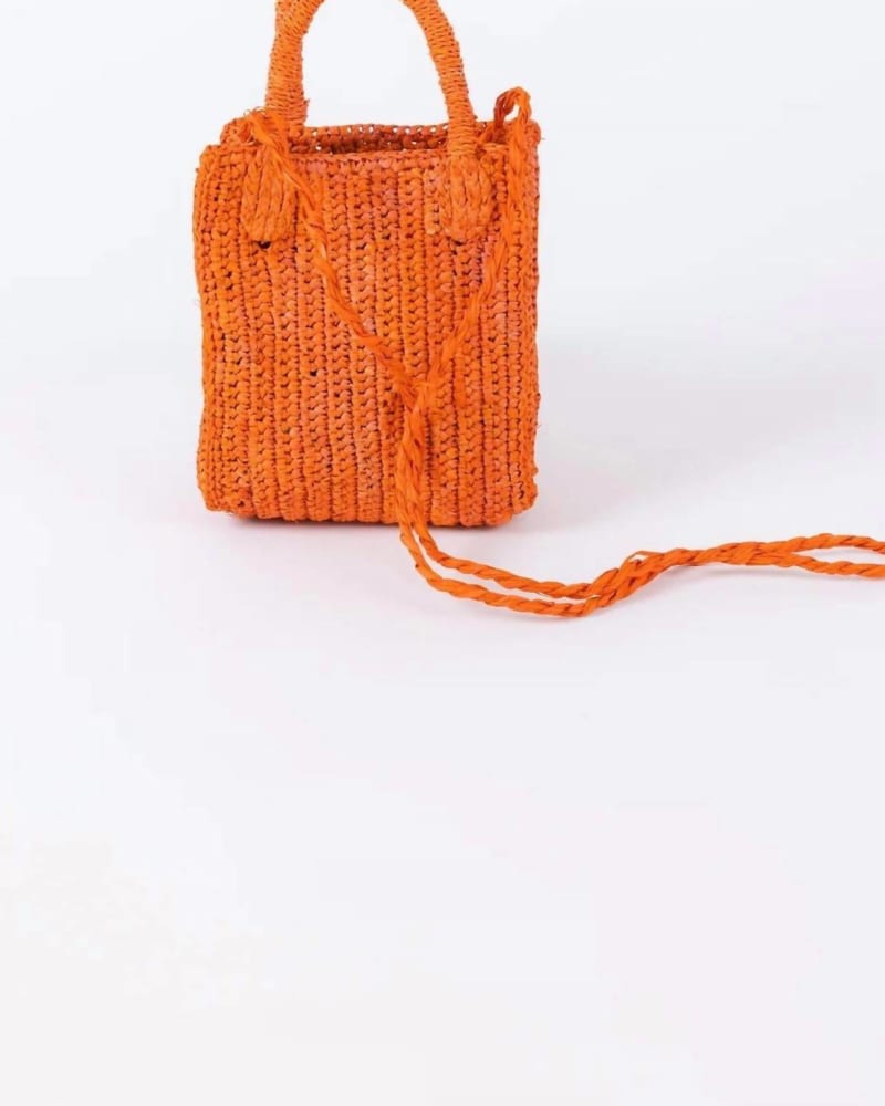 Front of a model wearing a size O/S Mimi Crossbody Bag in Orange in Orange by Hat Attack. | dia_product_style_image_id:345267